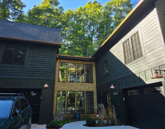 Dark-sided home with copper lights and new gutters