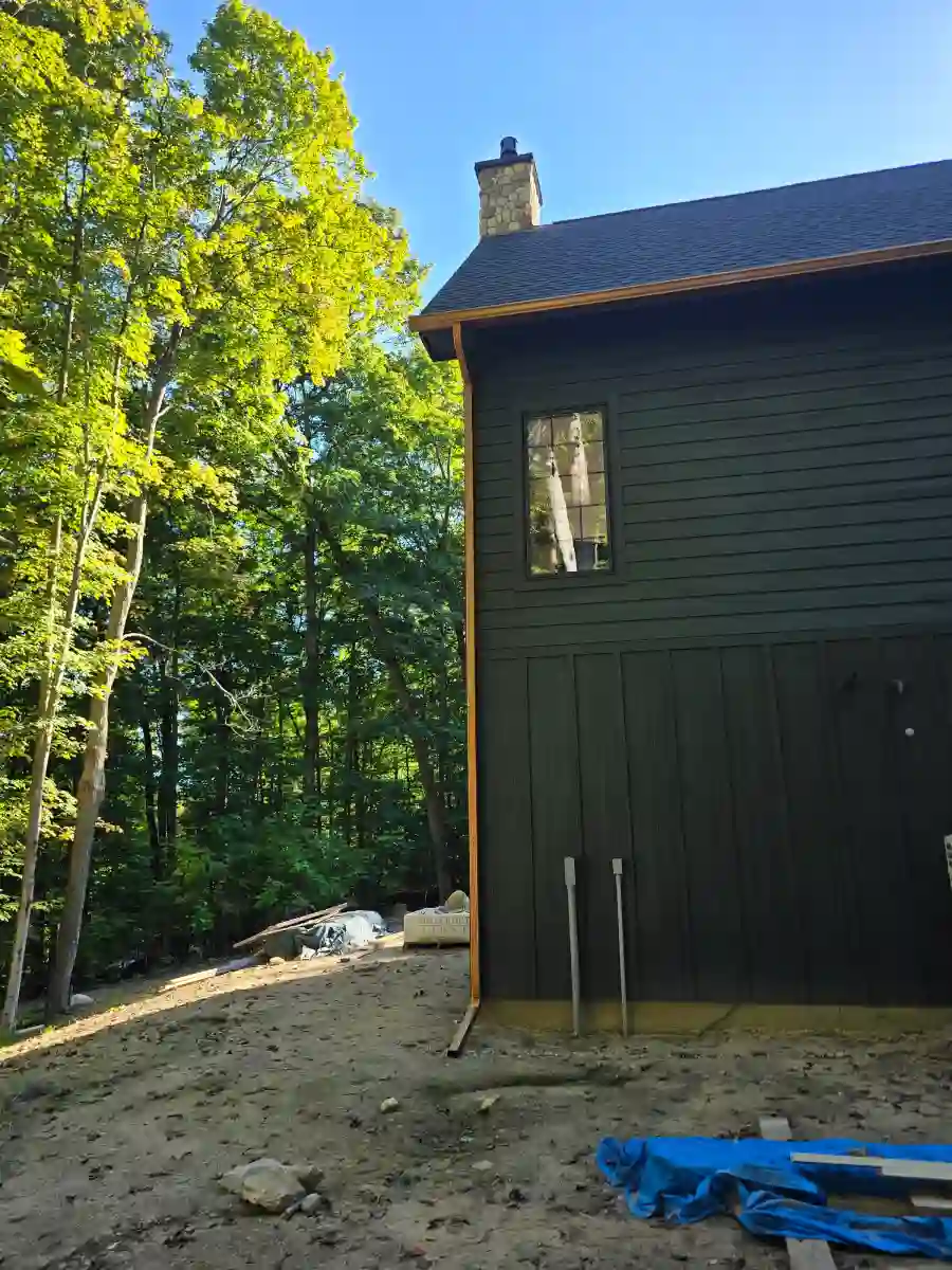 Dark board-and-batten siding on a tall home