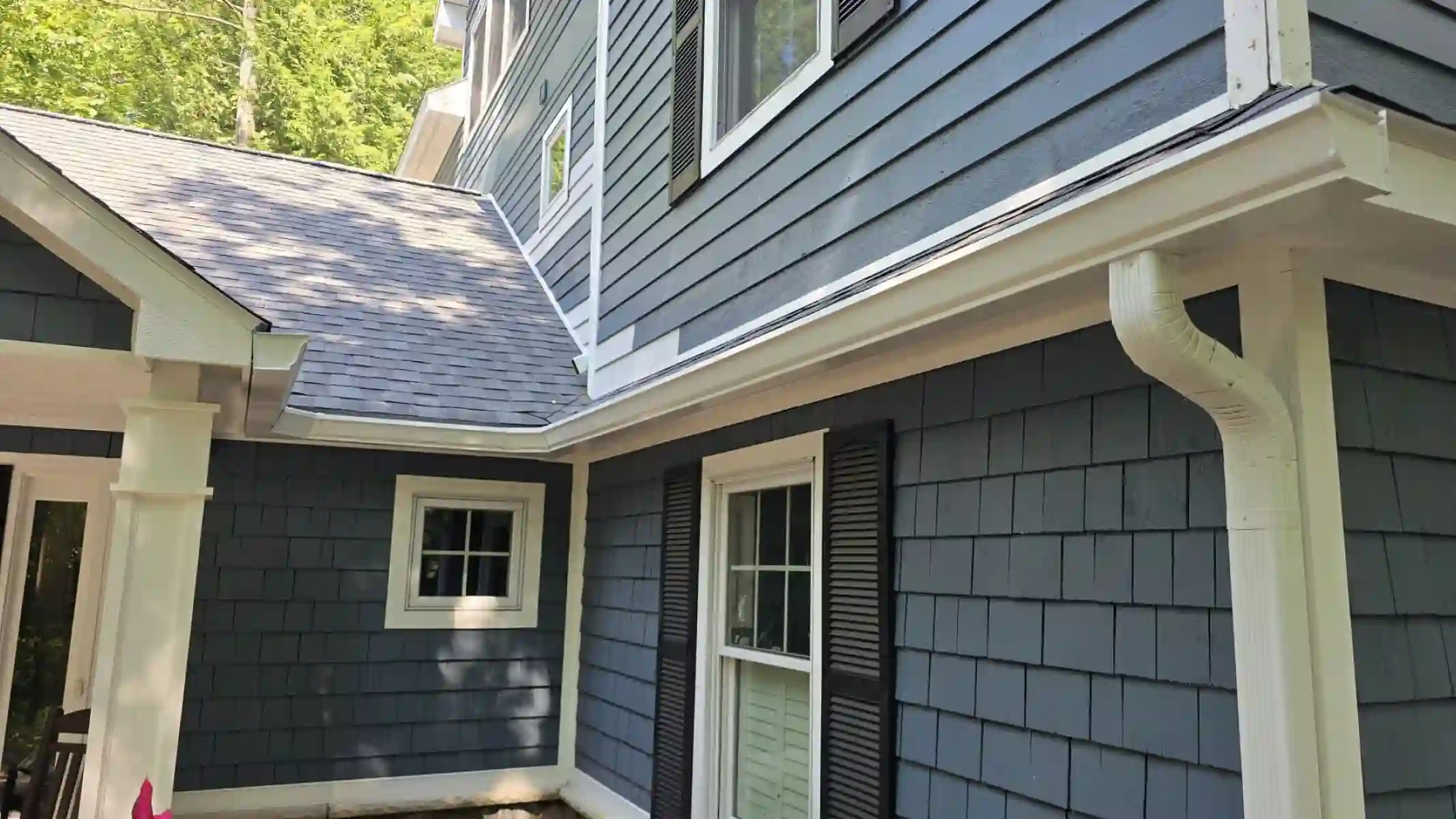 Blue lap and shake siding on a two-story home