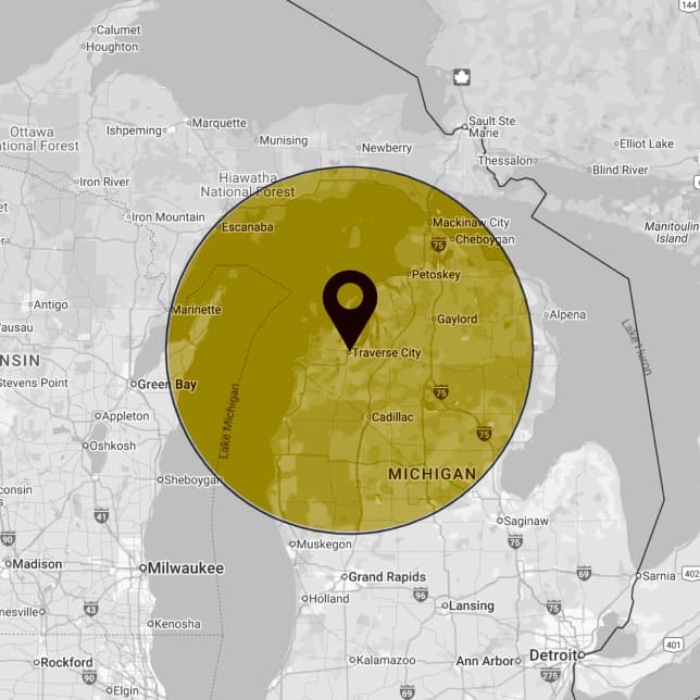 Map of Northern Michigan with a circle marking the Leading Edge Gutters service area around Traverse City